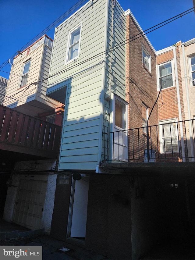 view of side of property with a garage