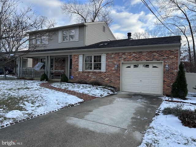 front of property with covered porch and a garage