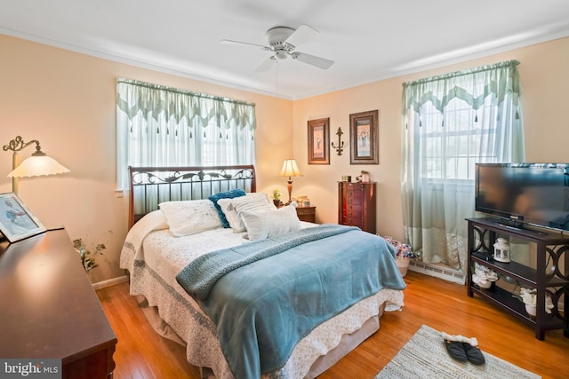 bedroom featuring ceiling fan and hardwood / wood-style flooring