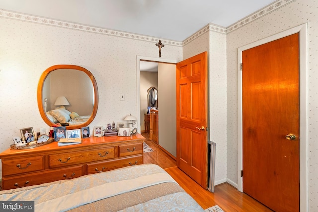 bedroom with light hardwood / wood-style floors