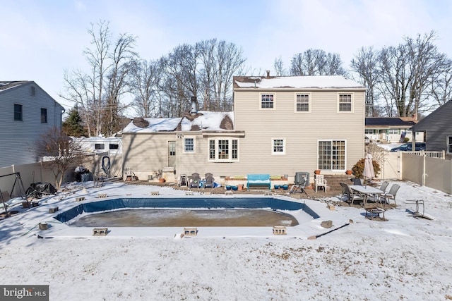 view of snow covered house