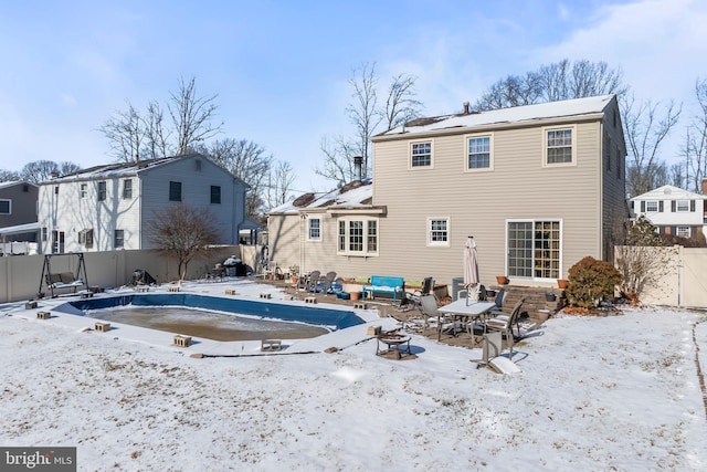 view of snow covered house