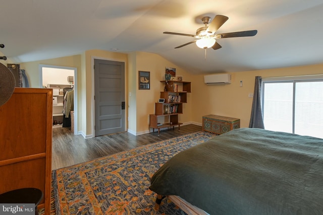 bedroom with lofted ceiling, ceiling fan, wood finished floors, baseboards, and a wall mounted AC