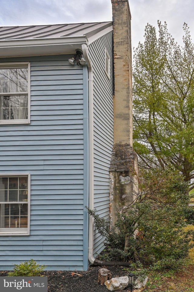 view of side of property with a chimney