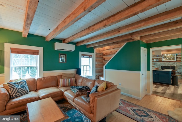 living room with wood ceiling, hardwood / wood-style floors, a wall mounted air conditioner, and beam ceiling