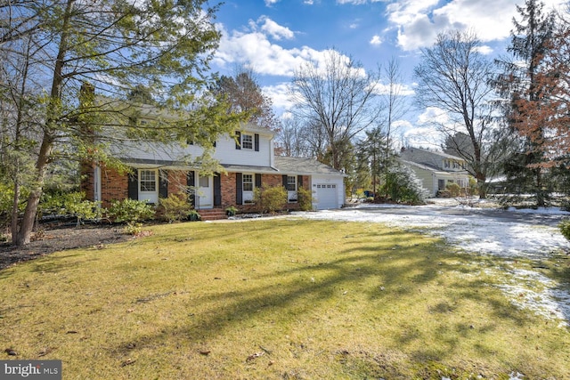 view of front facade with a garage and a front yard