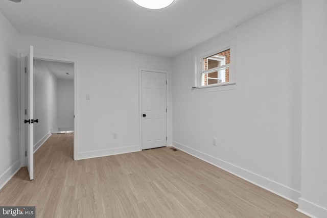 unfurnished bedroom featuring light wood-type flooring