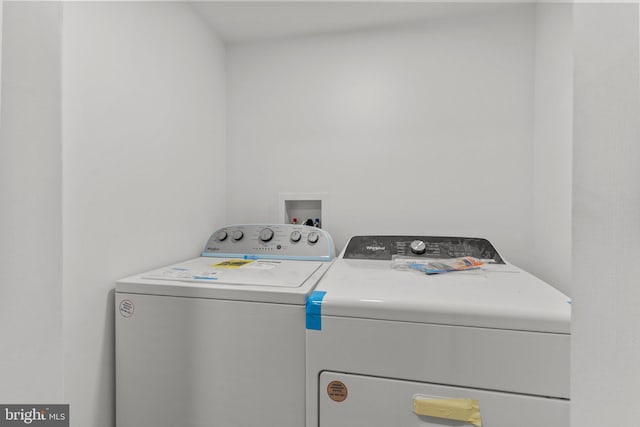 washroom featuring independent washer and dryer