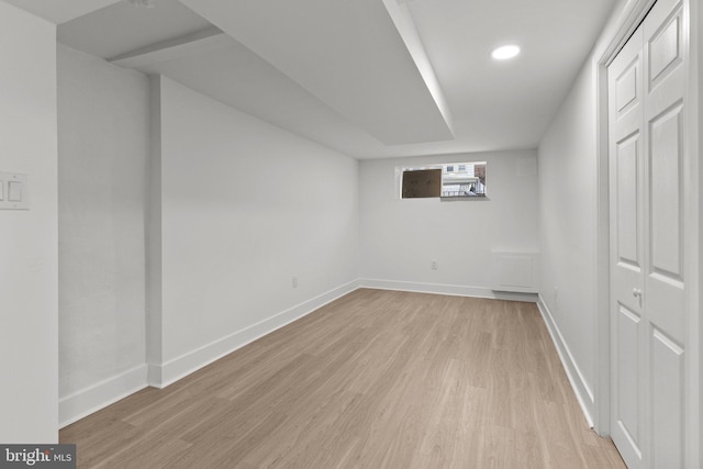 basement featuring light hardwood / wood-style floors