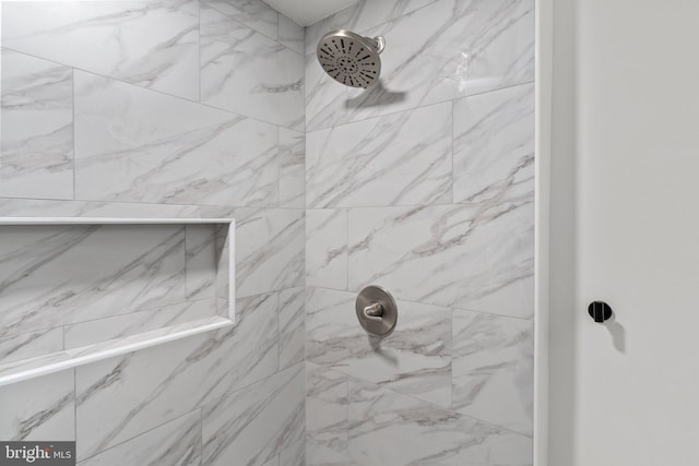 details with a tile shower