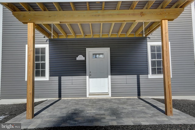 doorway to property with a patio area