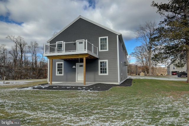 view of front of property with a yard and a patio