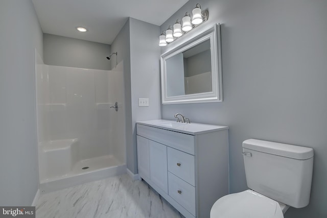 bathroom with vanity, toilet, and walk in shower