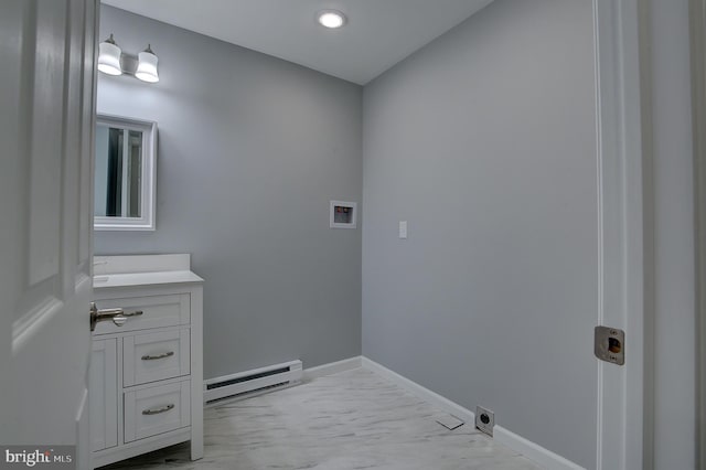 laundry room featuring hookup for an electric dryer, hookup for a washing machine, and a baseboard radiator