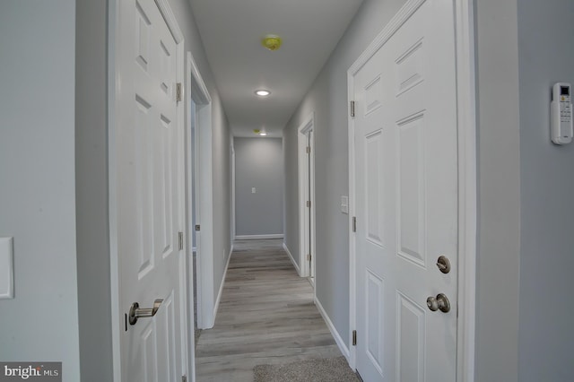 hallway featuring light hardwood / wood-style flooring