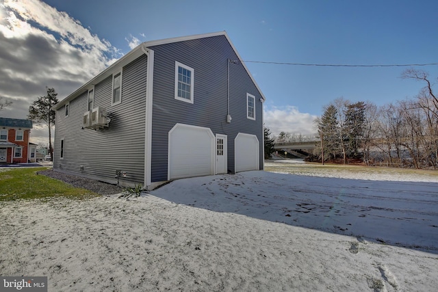 view of side of home with a garage