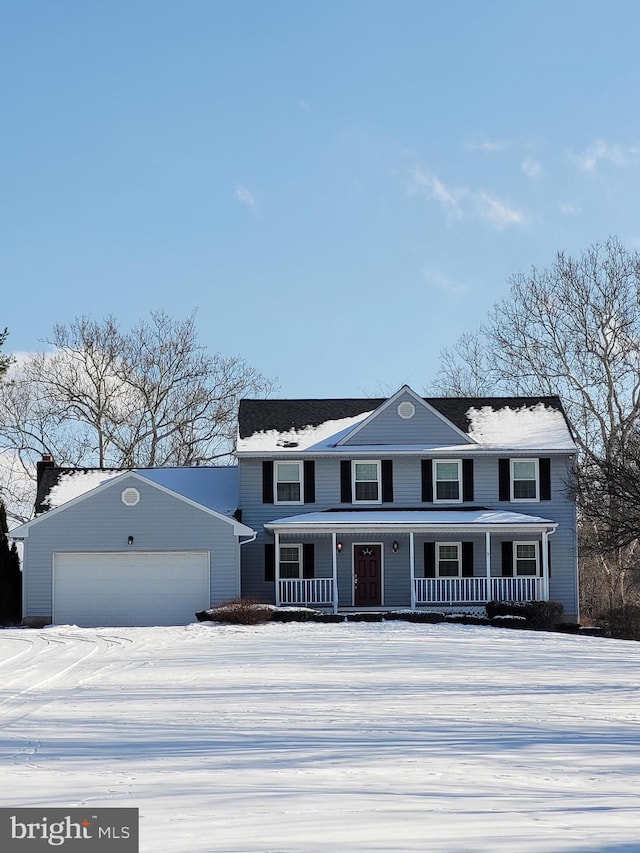 view of front of house featuring a porch and a garage