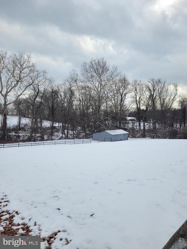 view of yard layered in snow