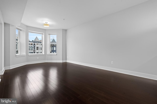 unfurnished room featuring hardwood / wood-style flooring