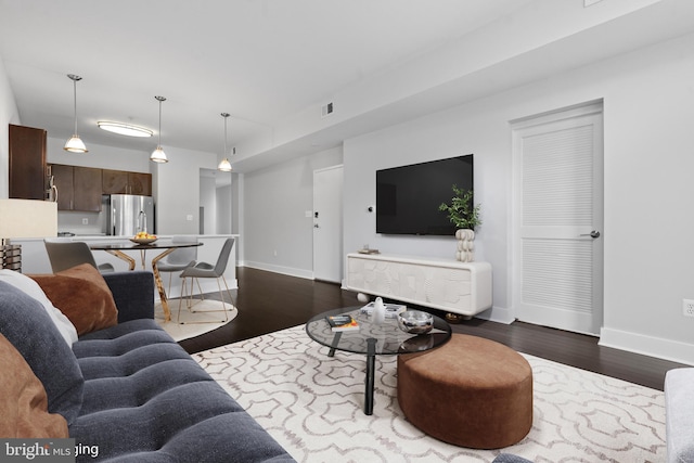 living room with dark wood-type flooring