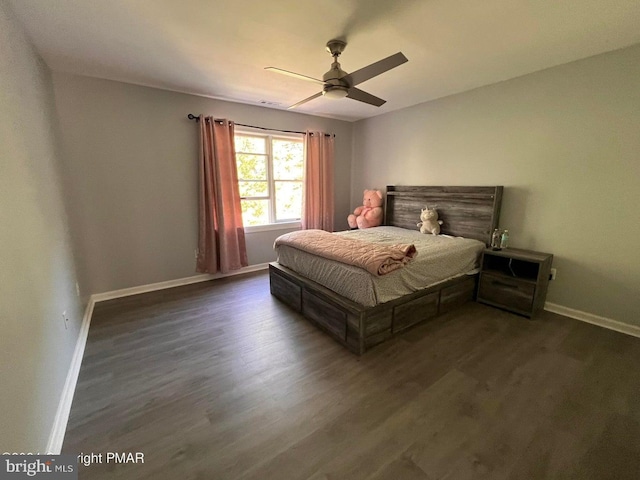 bedroom with ceiling fan and dark wood-type flooring