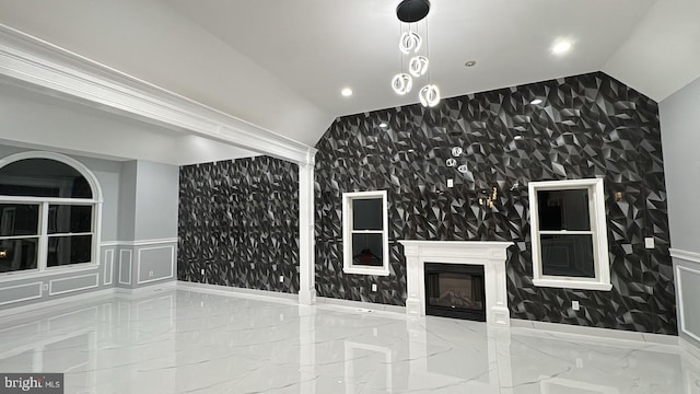 unfurnished living room featuring lofted ceiling