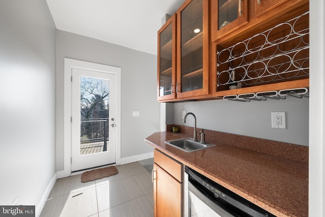 kitchen with dishwashing machine, sink, and light tile patterned floors