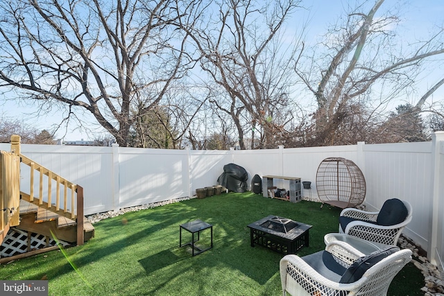 view of yard featuring a fire pit