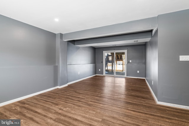 spare room with hardwood / wood-style floors