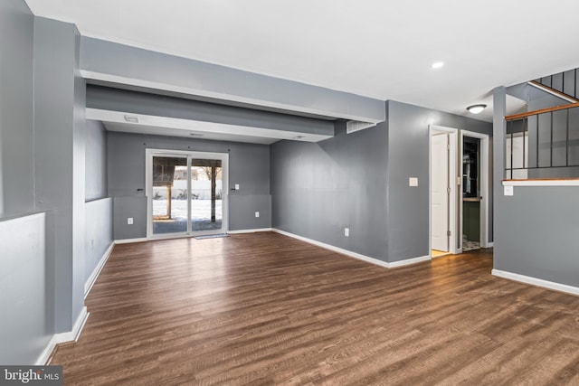 unfurnished room featuring dark wood-type flooring