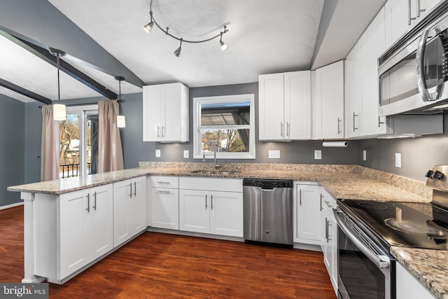 kitchen featuring sink, stainless steel appliances, and white cabinetry