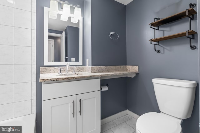 bathroom featuring toilet, tile patterned flooring, and vanity