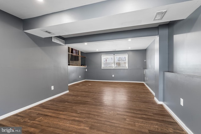 basement featuring dark hardwood / wood-style floors