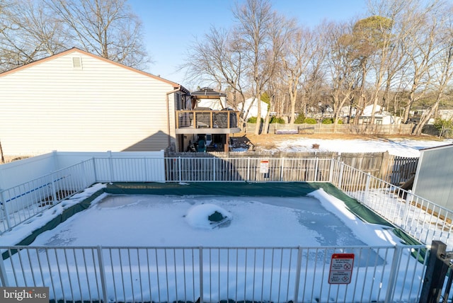 view of snow covered pool