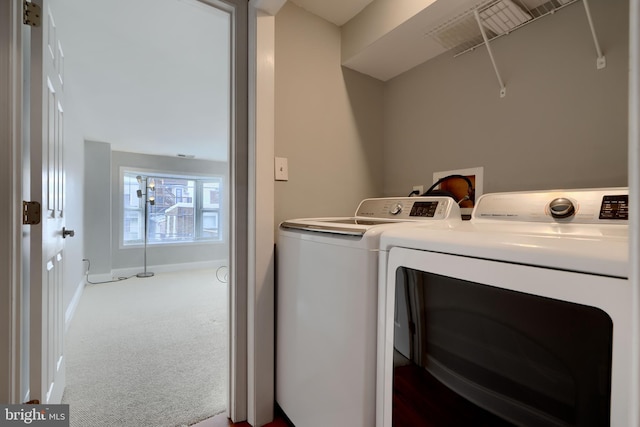 laundry area with laundry area, carpet floors, independent washer and dryer, and baseboards