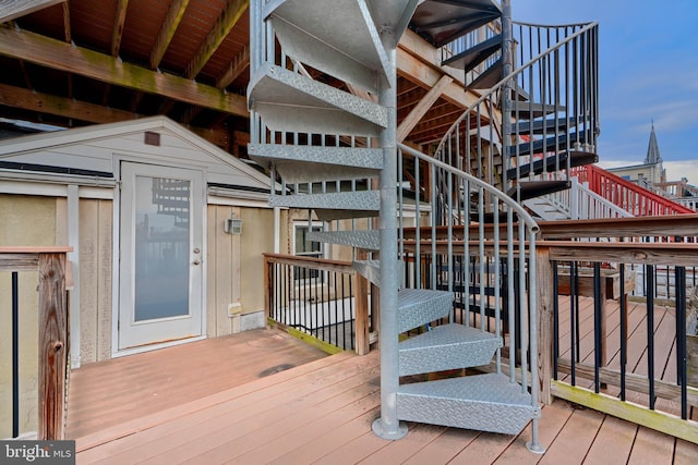 wooden deck featuring stairway