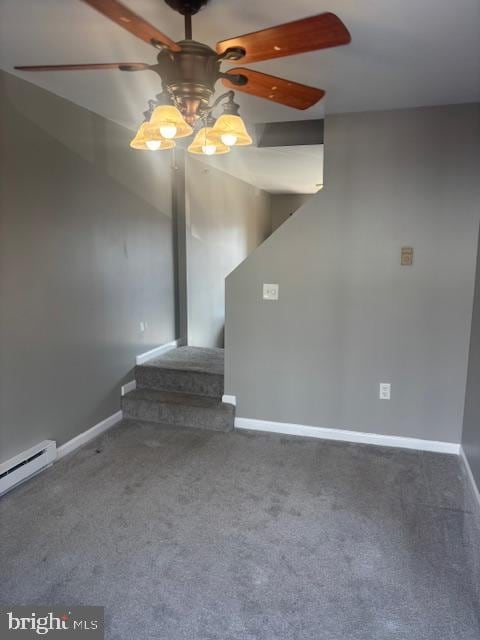 interior space featuring ceiling fan, carpet flooring, and a baseboard heating unit