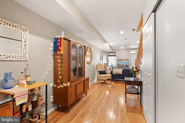 hall with light hardwood / wood-style flooring