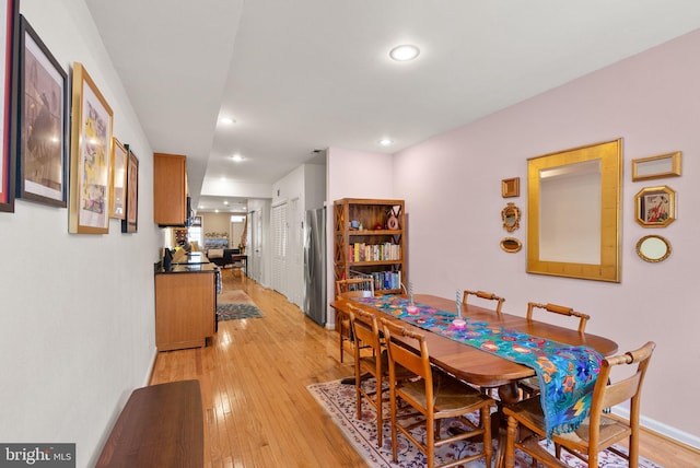 dining room with light wood-type flooring