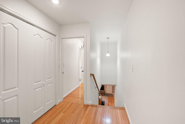 hallway with light hardwood / wood-style flooring