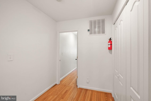 hallway with light wood-type flooring