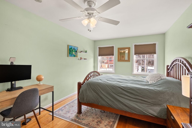 bedroom with ceiling fan and light hardwood / wood-style flooring