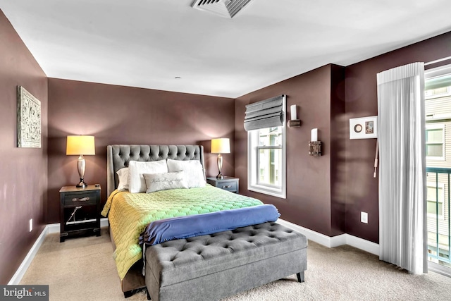 bedroom with light colored carpet