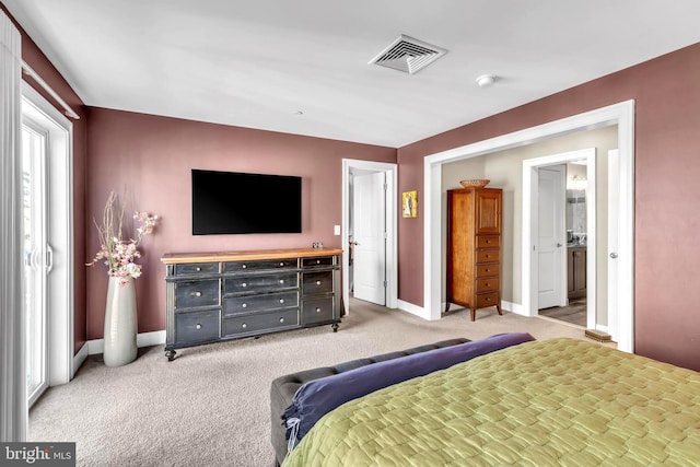 bedroom featuring light carpet