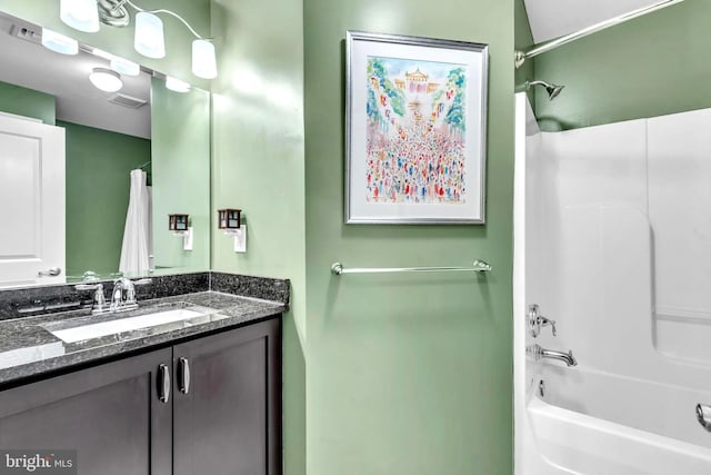 bathroom featuring vanity and tub / shower combination