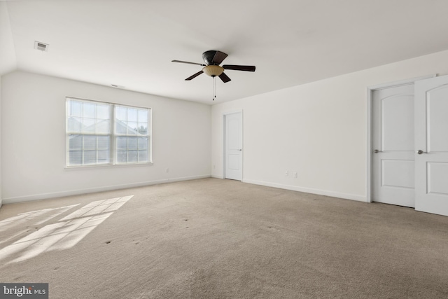 interior space with ceiling fan and lofted ceiling