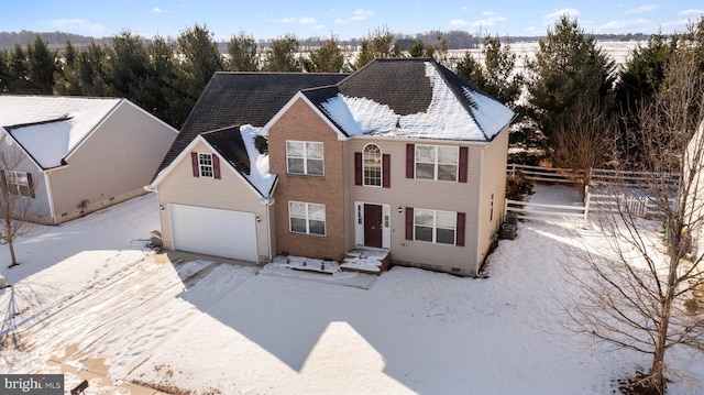 view of front of property with a garage