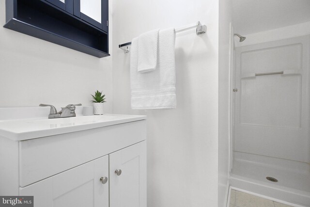 bathroom featuring vanity and walk in shower