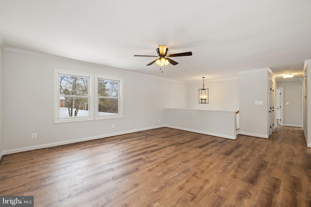 unfurnished living room featuring dark hardwood / wood-style flooring, ceiling fan, and crown molding