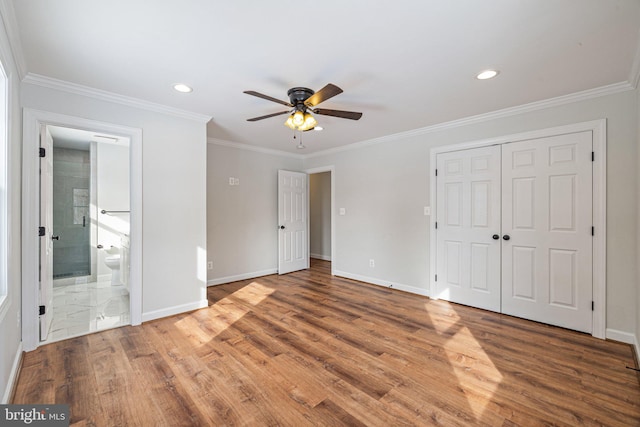 unfurnished bedroom with hardwood / wood-style floors, ceiling fan, and crown molding